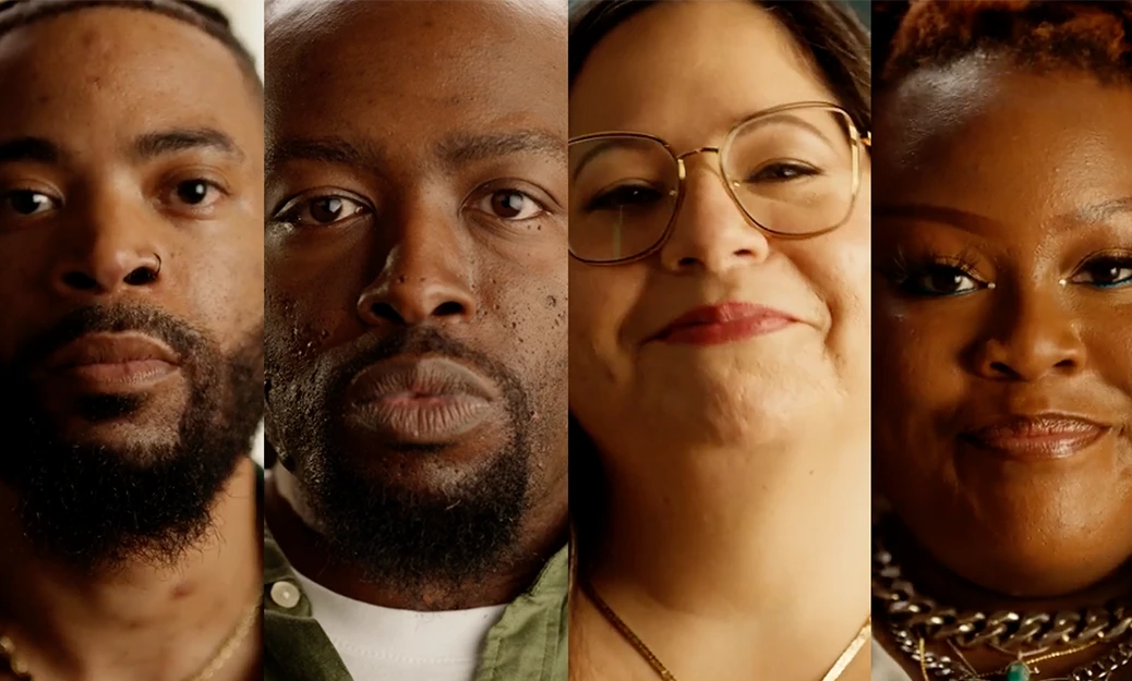 4 individuals looking straight at the camera. There is a green play button layered on top of the image 